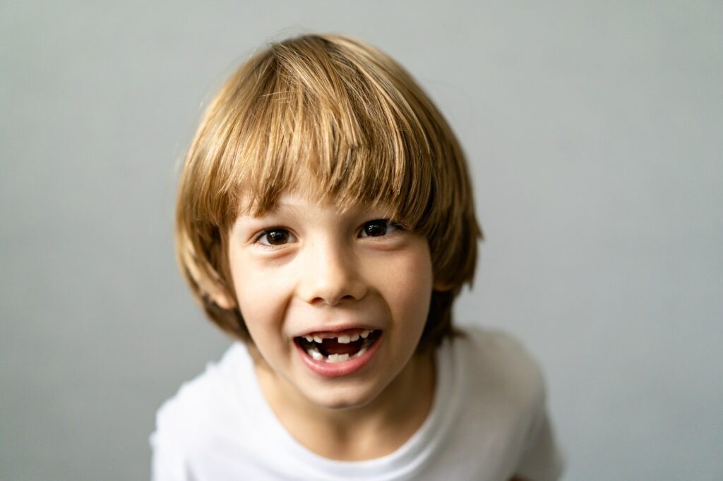 Toothless boy, change of milk teeth, smile, happy child, dentistry, orthodontist
